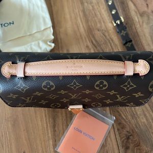 Louie V not sure if real that’s why selling at low cost.  Has tags and duster.